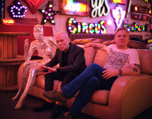 Erasure sat on a sofa next to a glittery mannequin
