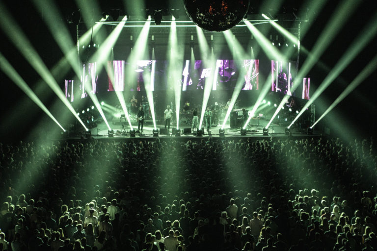 connect music festival stage lit in green