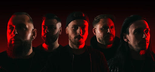The Faces of the members of the defects band with a red light highlighting them