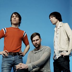 The cribs stood in front of a blue wall