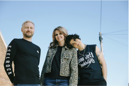 The subways stood smiling with a blue sky behind them