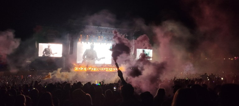 A flare being waved in the crowd during The Courteeners set at kendal calling 2025