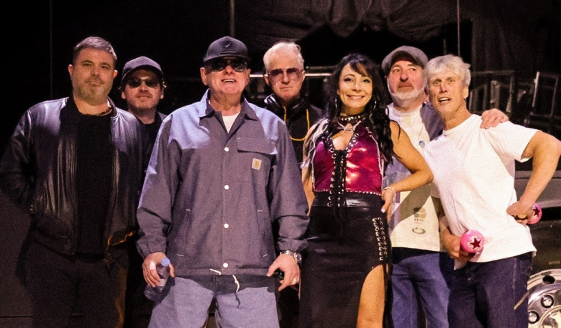 Happy Mondays on stage in a line