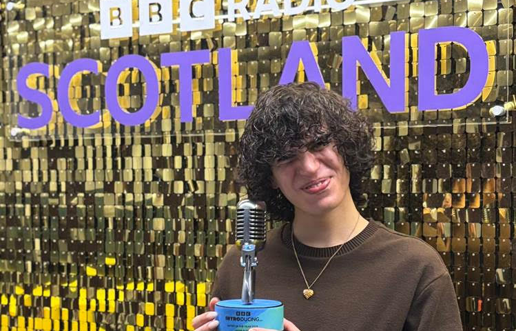 Jacob Alon showing his BBC introducing trophy off