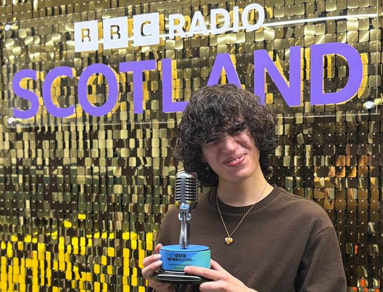 Jacob Alon showing his BBC introducing trophy off