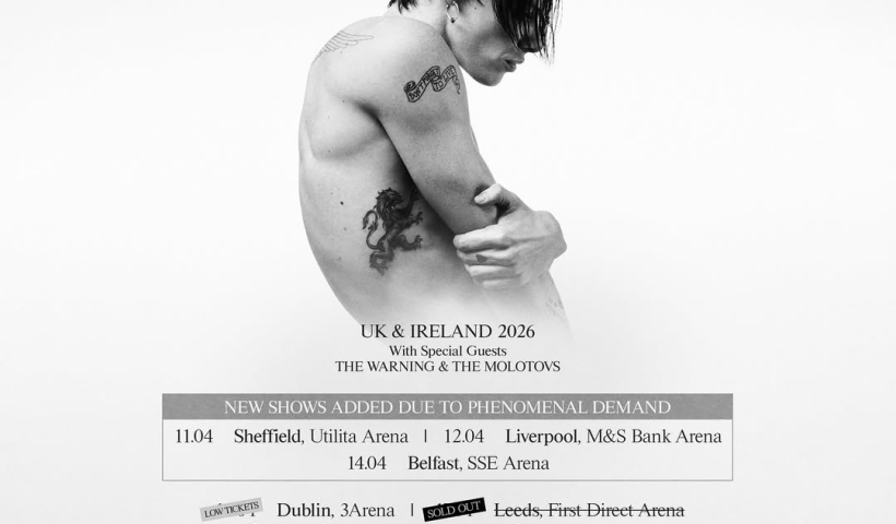 Youngblud photographed in black and white, topless and from a side profile